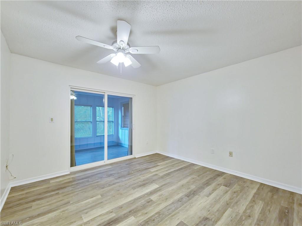 7425 Galloway Road Weeki Wachee, FL 34613 - Photo 7 of 23 wooden floor in an empty room