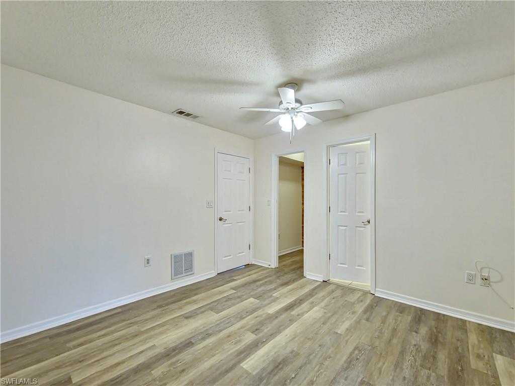 7425 Galloway Road Weeki Wachee, FL 34613 - Photo 8 of 23 wooden floor in an empty room