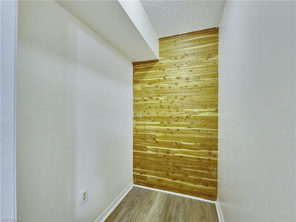 7425 Galloway Road Weeki Wachee, FL 34613 - Photo 9 of 23 a view of walk in closet with empty racks