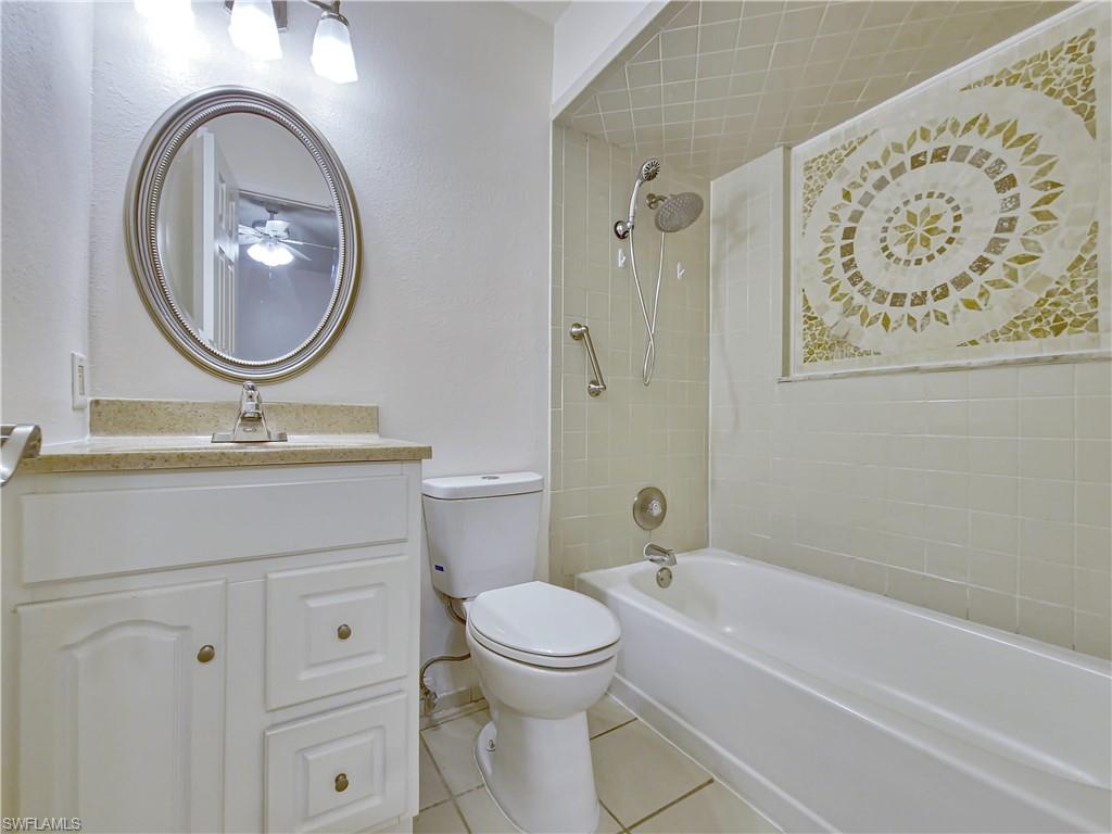 7425 Galloway Road Weeki Wachee, FL 34613 - Photo 10 of 23 a bathroom with a toilet a sink and a bathtub