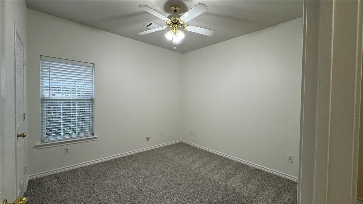 1502 Bluefield Court College Station, TX 77845 - Photo 13 of 26 an empty room with windows and fan