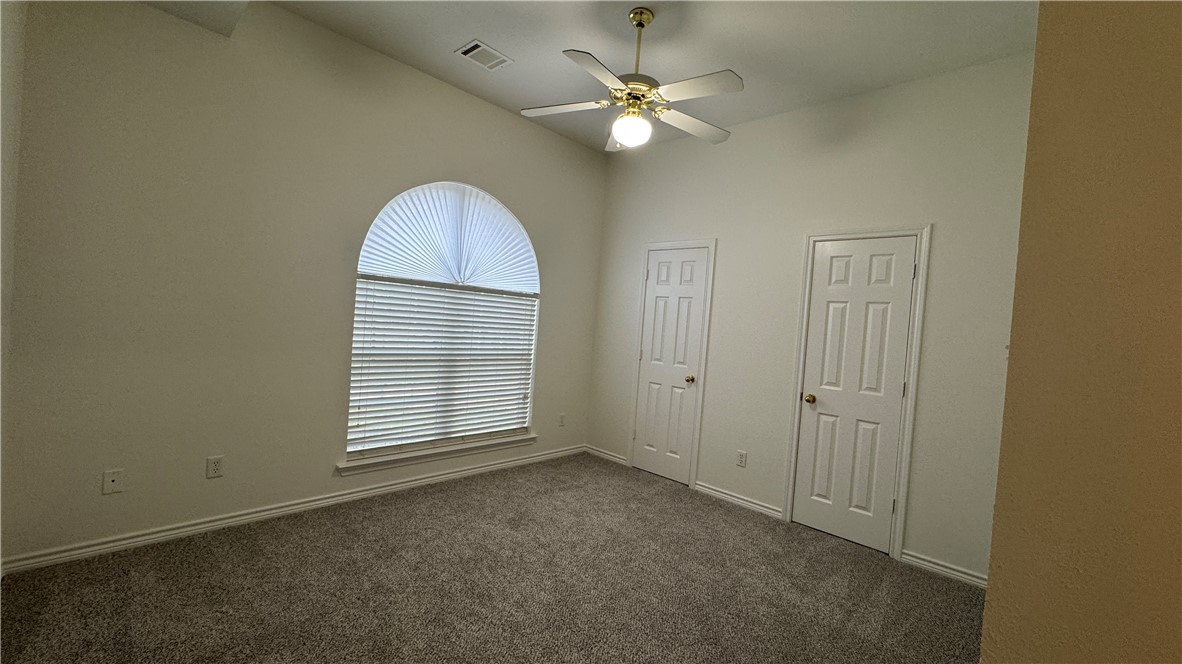 1502 Bluefield Court College Station, TX 77845 - Photo 15 of 26 an empty room with windows and fan
