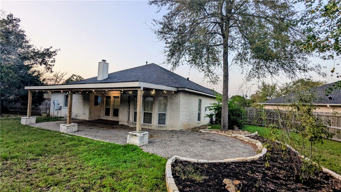 1502 Bluefield Court College Station, TX 77845 - Photo 19 of 26 a backyard of a house with table and chairs