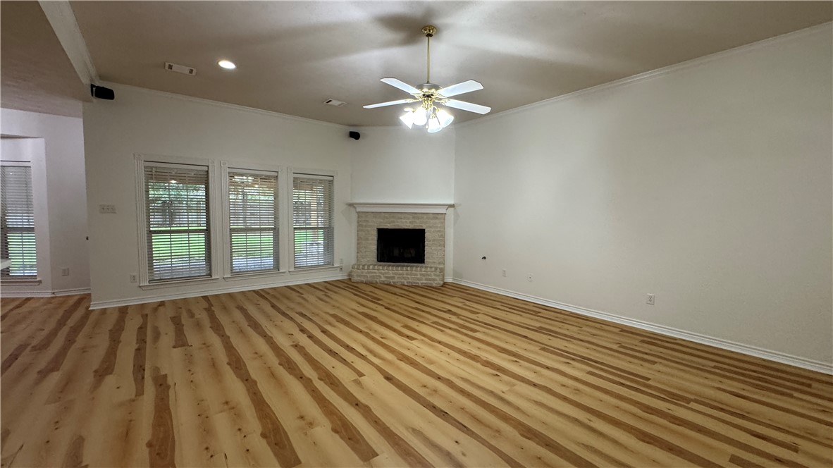 1502 Bluefield Court College Station, TX 77845 - Photo 6 of 26 wooden floor in an empty room with a window