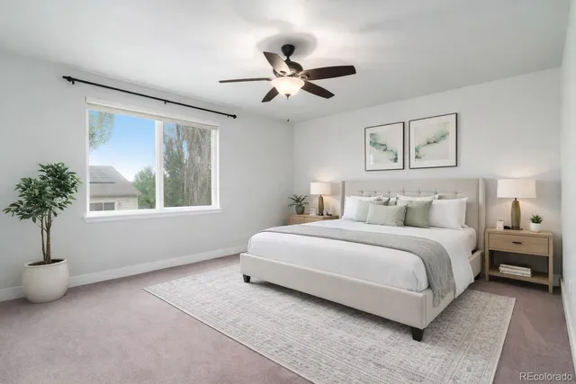 a spacious bedroom with a bed and a window