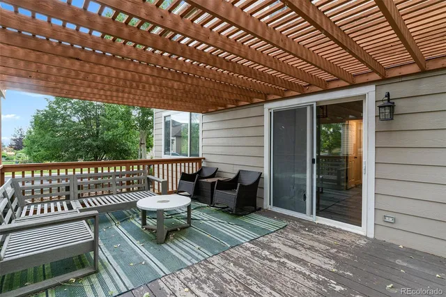 a view of a balcony with chairs