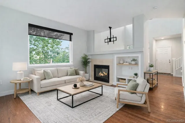 a living room with furniture and a fireplace