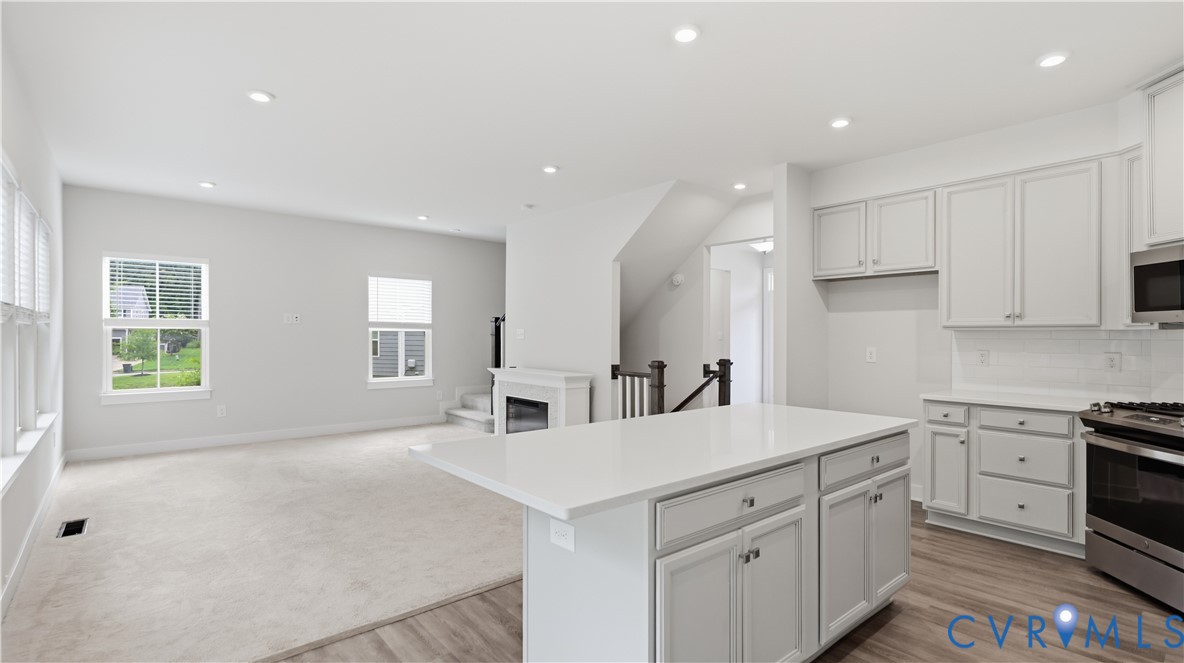 9308 Rudders Point Cove Mechanicsville, VA 23116 - Photo 12 of 50 Open-concept living area featuring a kitchen islan