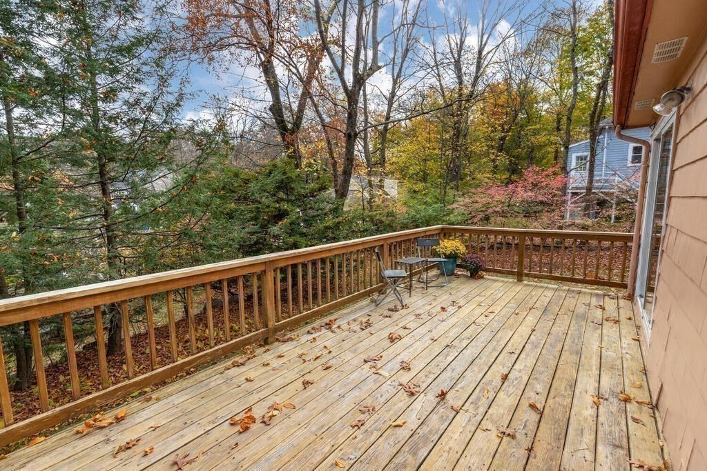 14 Tarbell Avenue Lexington, MA 02421 - Photo 14 of 30 a view of balcony with wooden floor and fence
