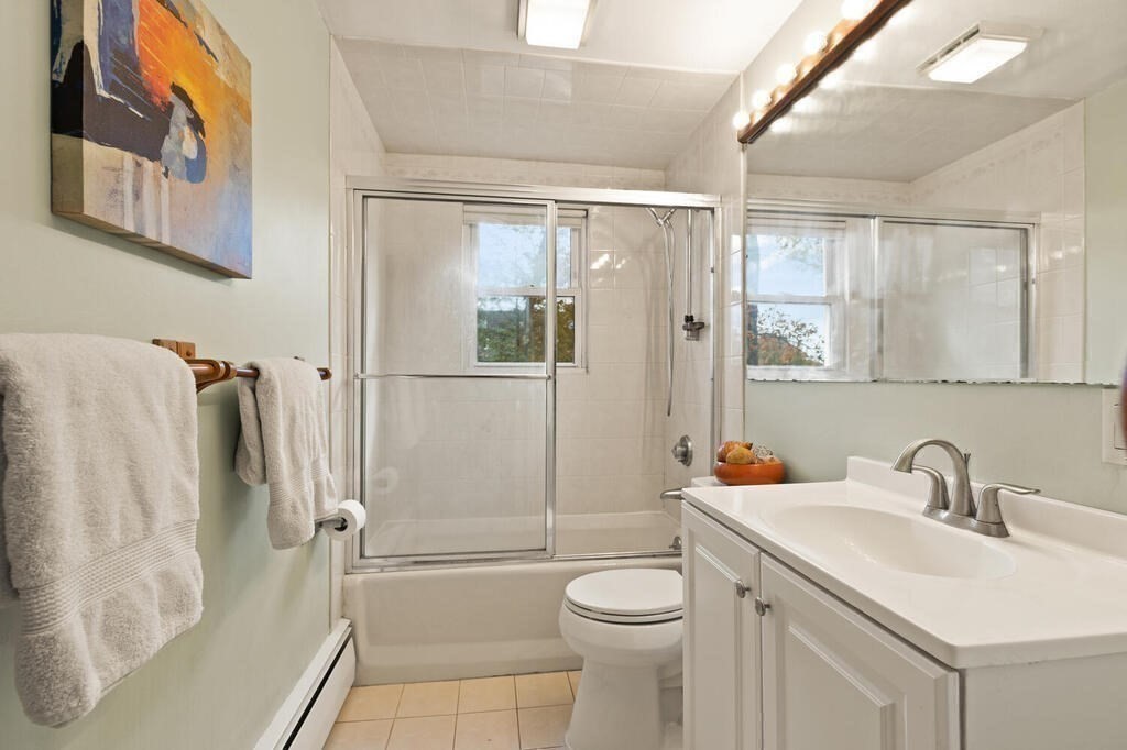 14 Tarbell Avenue Lexington, MA 02421 - Photo 15 of 30 a bathroom with a sink toilet and shower