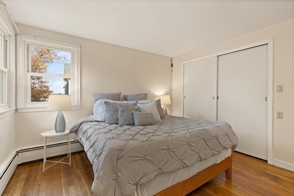 14 Tarbell Avenue Lexington, MA 02421 - Photo 19 of 30 a bedroom with a bed and a window