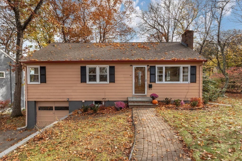 14 Tarbell Avenue Lexington, MA 02421 - Photo 2 of 30 a backyard of a house with wooden fence and trees