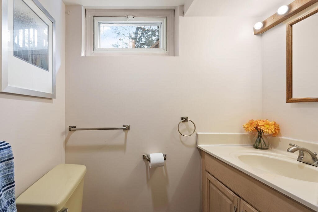 14 Tarbell Avenue Lexington, MA 02421 - Photo 26 of 30 a bathroom with a toilet sink and mirror