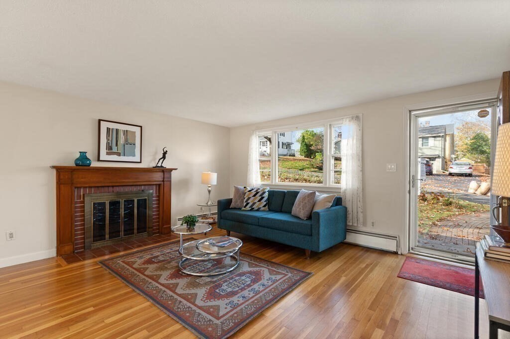 14 Tarbell Avenue Lexington, MA 02421 - Photo 4 of 30 a living room with furniture and a fireplace