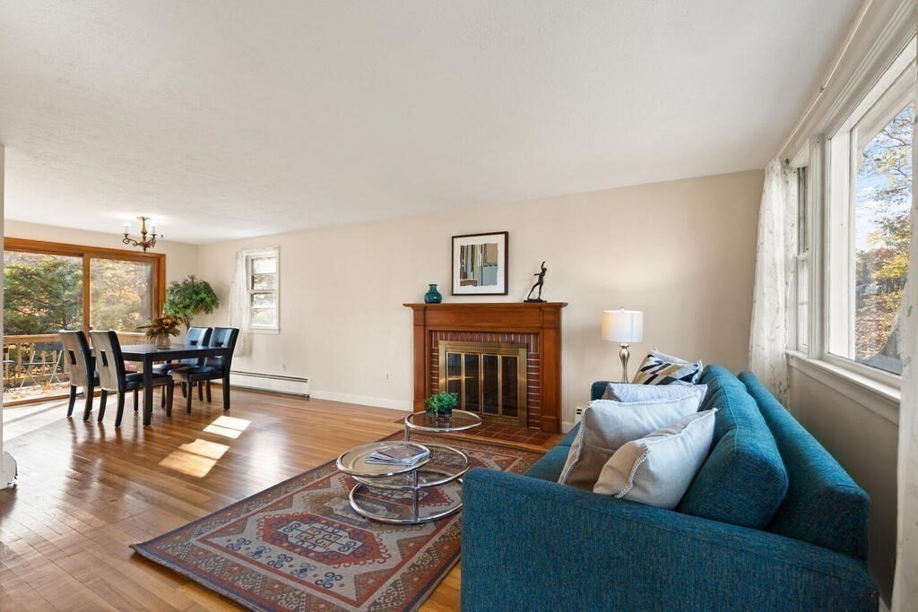 14 Tarbell Avenue Lexington, MA 02421 - Photo 5 of 30 a living room with furniture and a fireplace