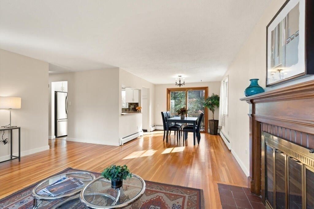 14 Tarbell Avenue Lexington, MA 02421 - Photo 6 of 30 a living room with furniture a fireplace and wooden floor