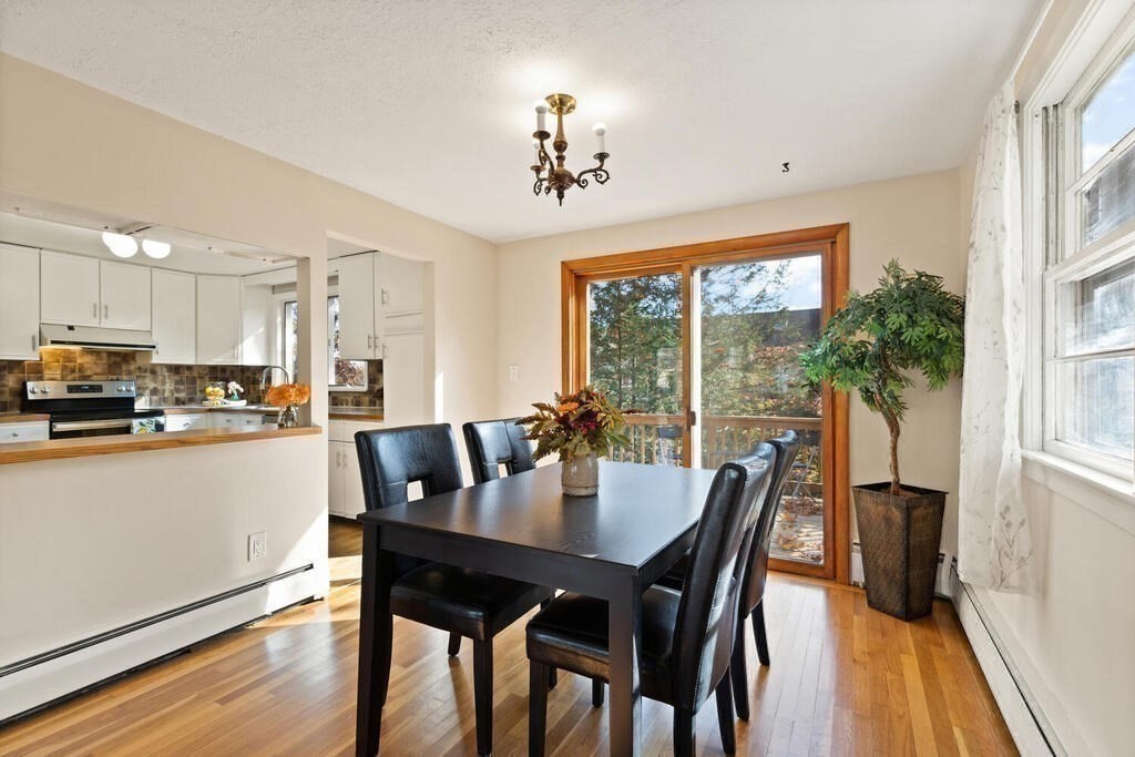 14 Tarbell Avenue Lexington, MA 02421 - Photo 8 of 30 a view of a dining room with furniture window and wooden floor