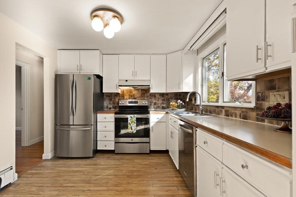 14 Tarbell Avenue Lexington, MA 02421 - Photo 10 of 30 a kitchen with a refrigerator and a sink