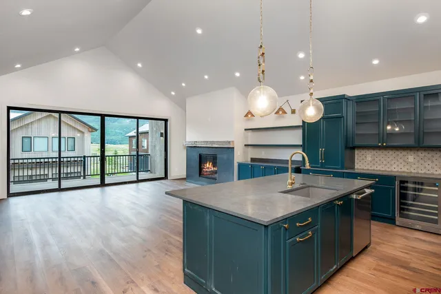 a kitchen with a refrigerator and a sink