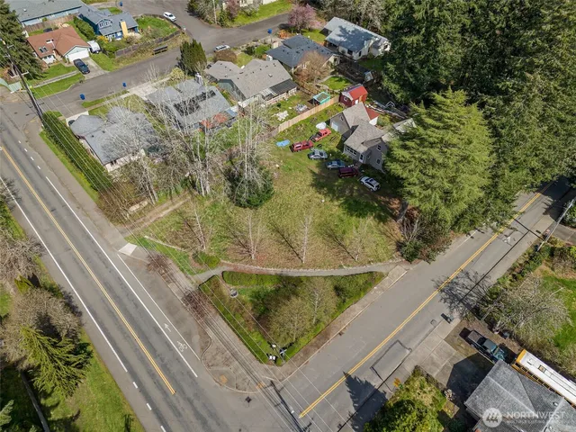 an aerial view of residential houses with outdoor space
