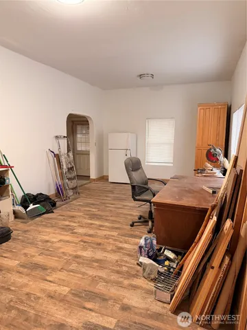 a room with gym equipment and a window