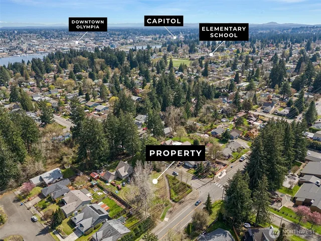 an aerial view of a house with a yard