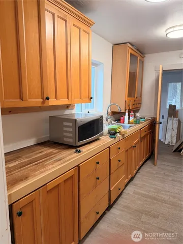 a kitchen with stainless steel appliances sink and cabinets