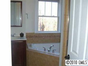 221 Mills Lane Fort Mill, SC 29708 - Photo 6 of 8 a bath room with a sink and a window