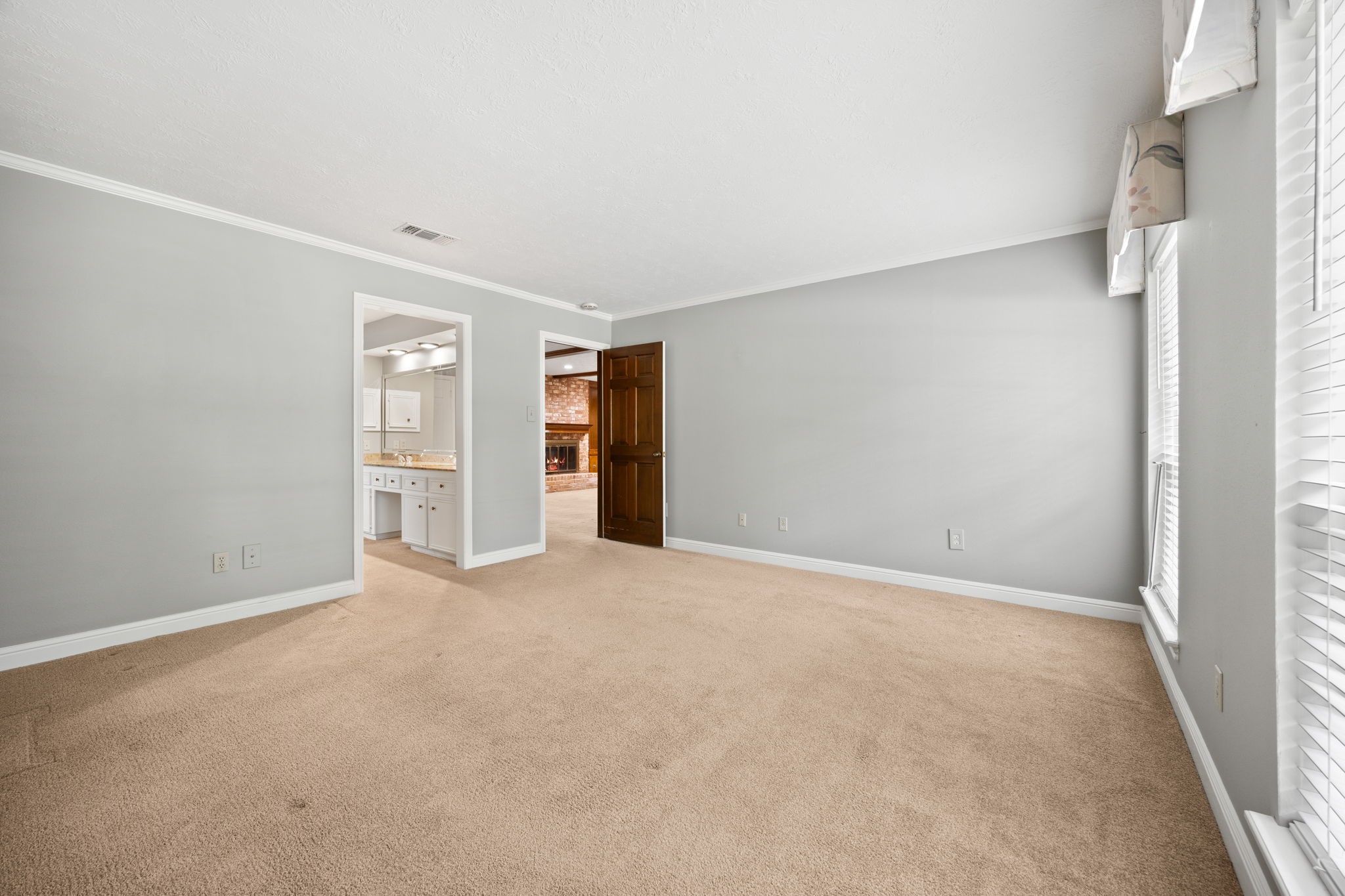 6623 Ampton Drive Spring, TX 77379 - Photo 23 of 45 Primary bedroom is right of the family room. Granite in the primary bathroom.