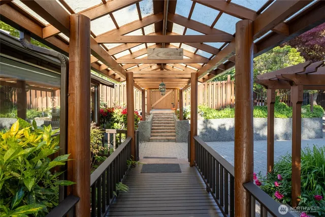 a view of an entryway door and potted plants