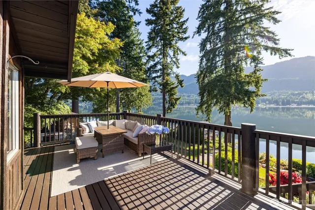 a view of balcony with wooden floor and outdoor seating