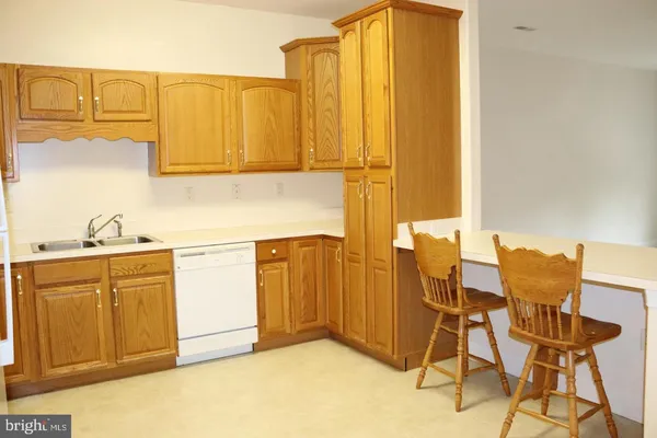 a view of a kitchen with electric appliances