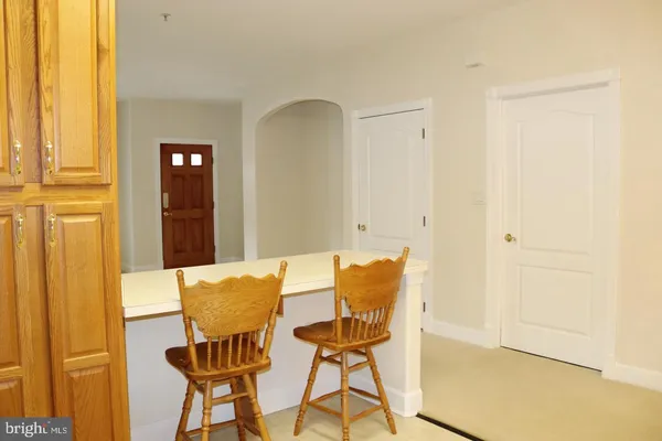 a view of a dining room with furniture and a window