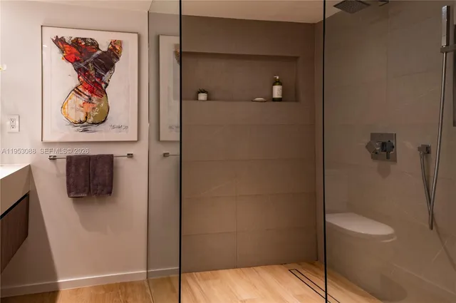 a bathroom with a shower and a sink