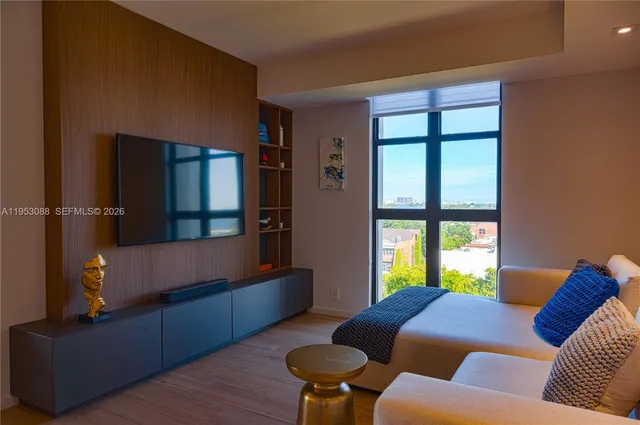 a living room with furniture and a window