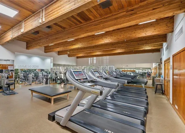 a view of a gym with wooden floor