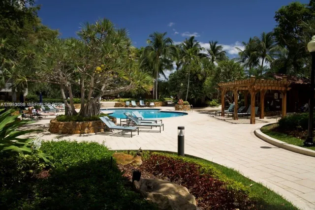 a view of a park with plants and trees