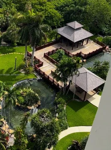 an aerial view of a house with garden space and street view