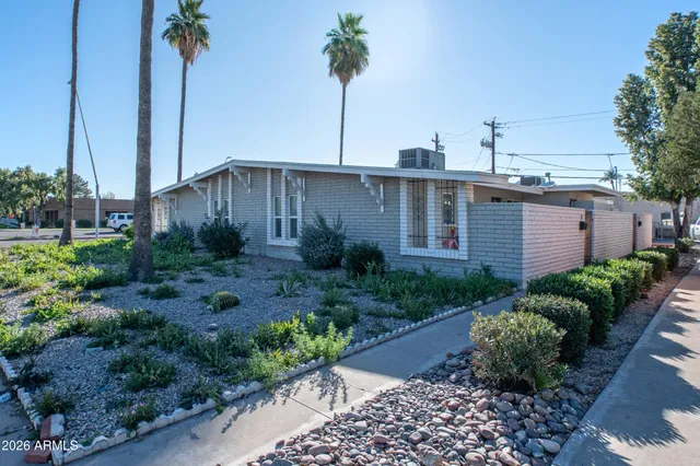 a view of a house with a garden