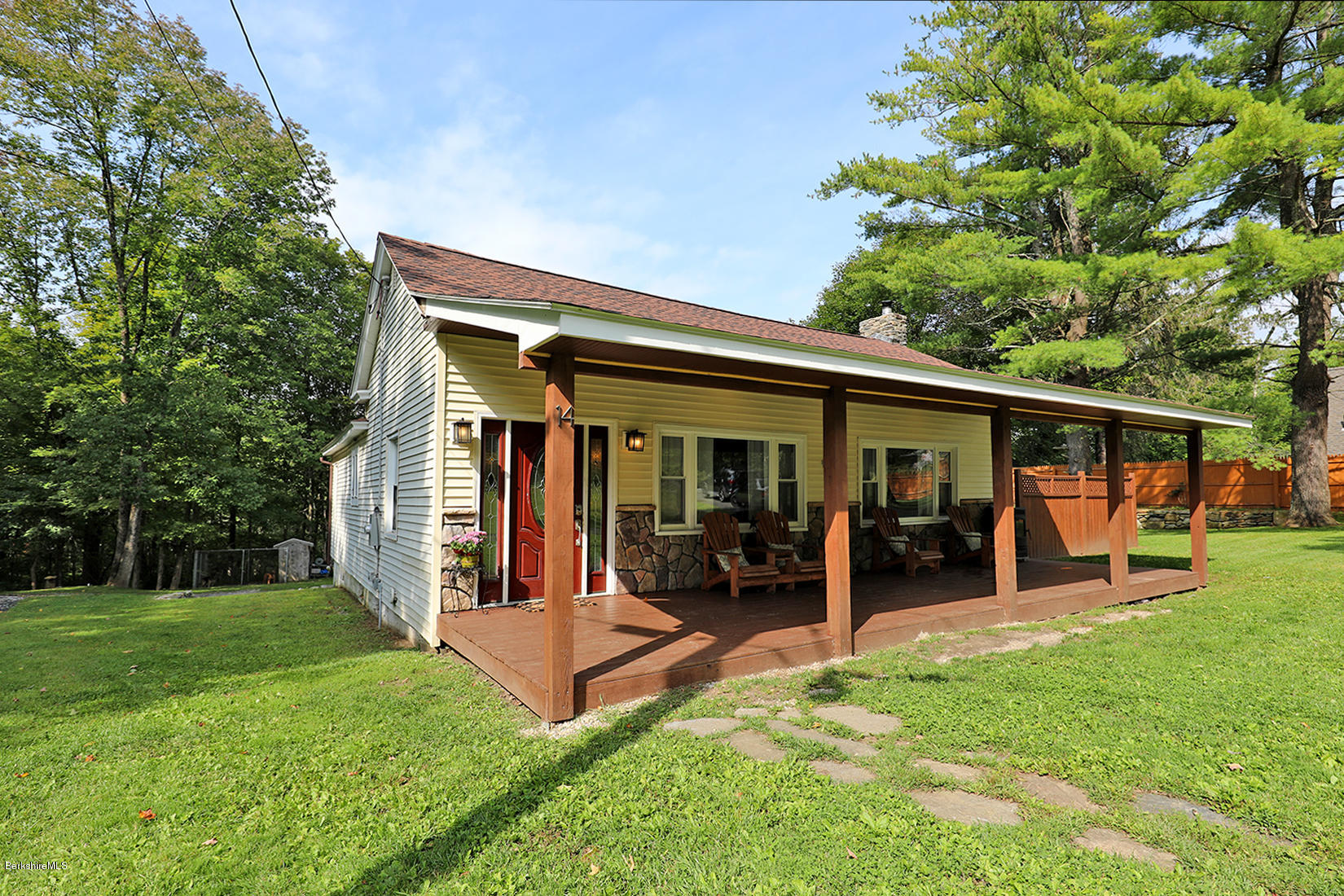 14 Ed Jones Road Otis, MA 01253 - Photo 2 of 28 a view of a house with backyard porch and sitting area