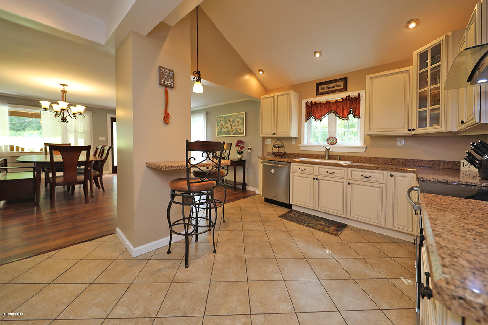 14 Ed Jones Road Otis, MA 01253 - Photo 14 of 28 a kitchen with granite countertop a sink cabinets and stainless steel appliances