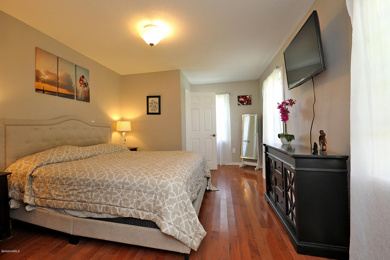 14 Ed Jones Road Otis, MA 01253 - Photo 15 of 28 a bedroom with a bed and wooden floor