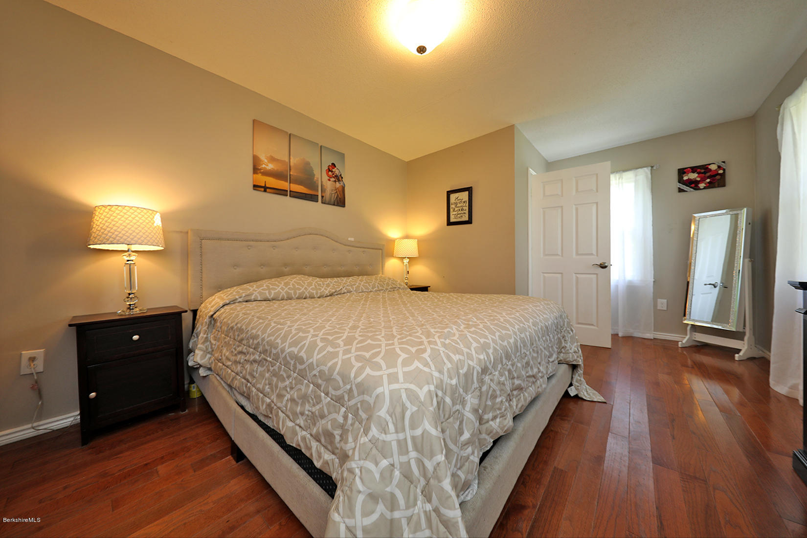 14 Ed Jones Road Otis, MA 01253 - Photo 18 of 28 a bedroom with a bed and a lamp