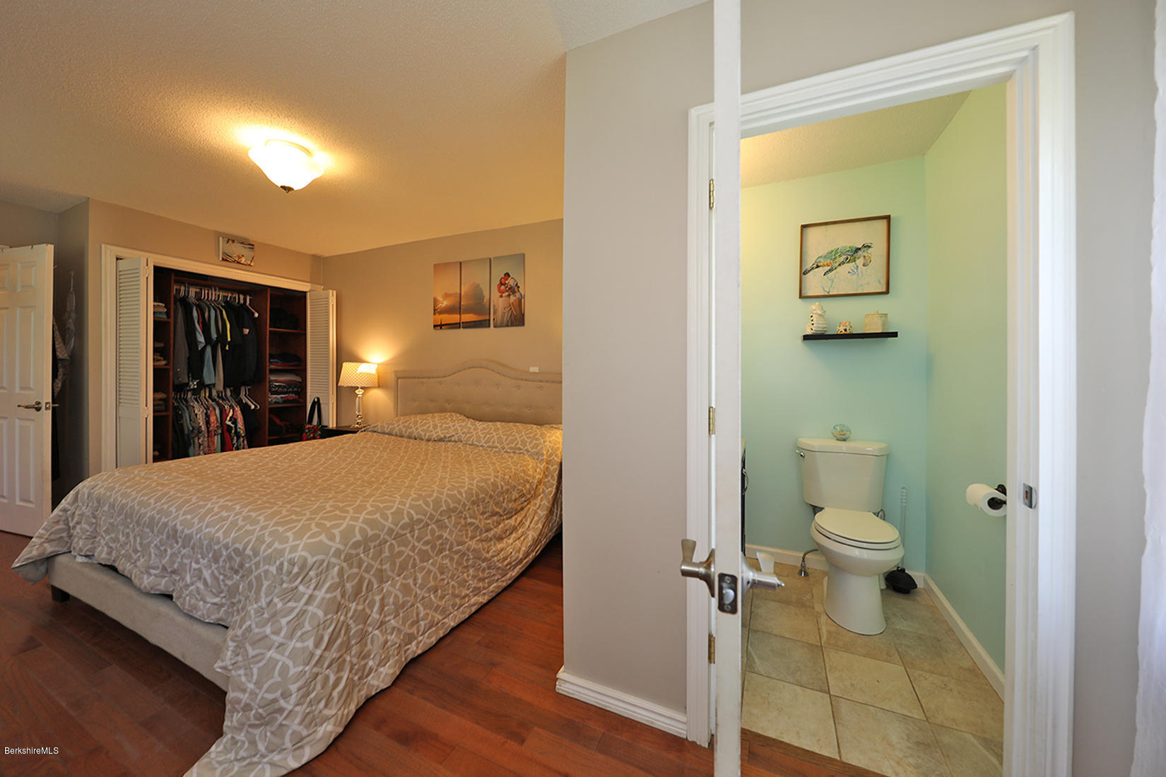 14 Ed Jones Road Otis, MA 01253 - Photo 19 of 28 a en suite bathroom with a granite countertop toilet and a sink