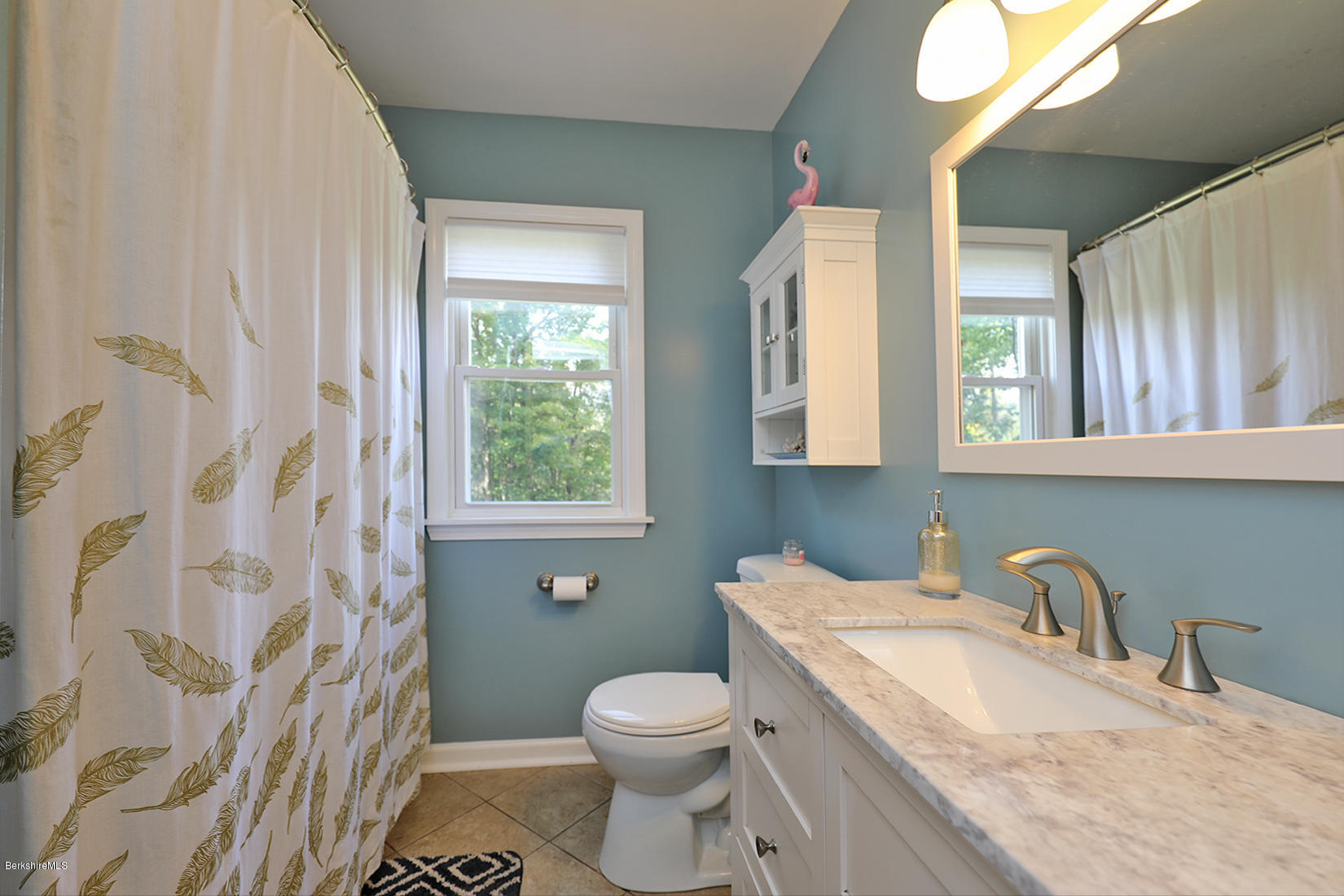 14 Ed Jones Road Otis, MA 01253 - Photo 21 of 28 a bathroom with a granite countertop sink a toilet and a mirror