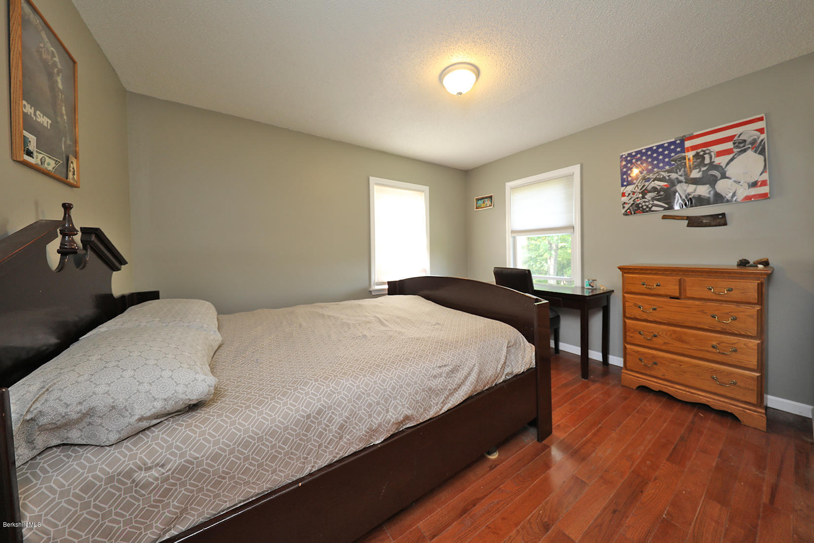 14 Ed Jones Road Otis, MA 01253 - Photo 22 of 28 a bedroom with a bed and a dresser with wooden floor