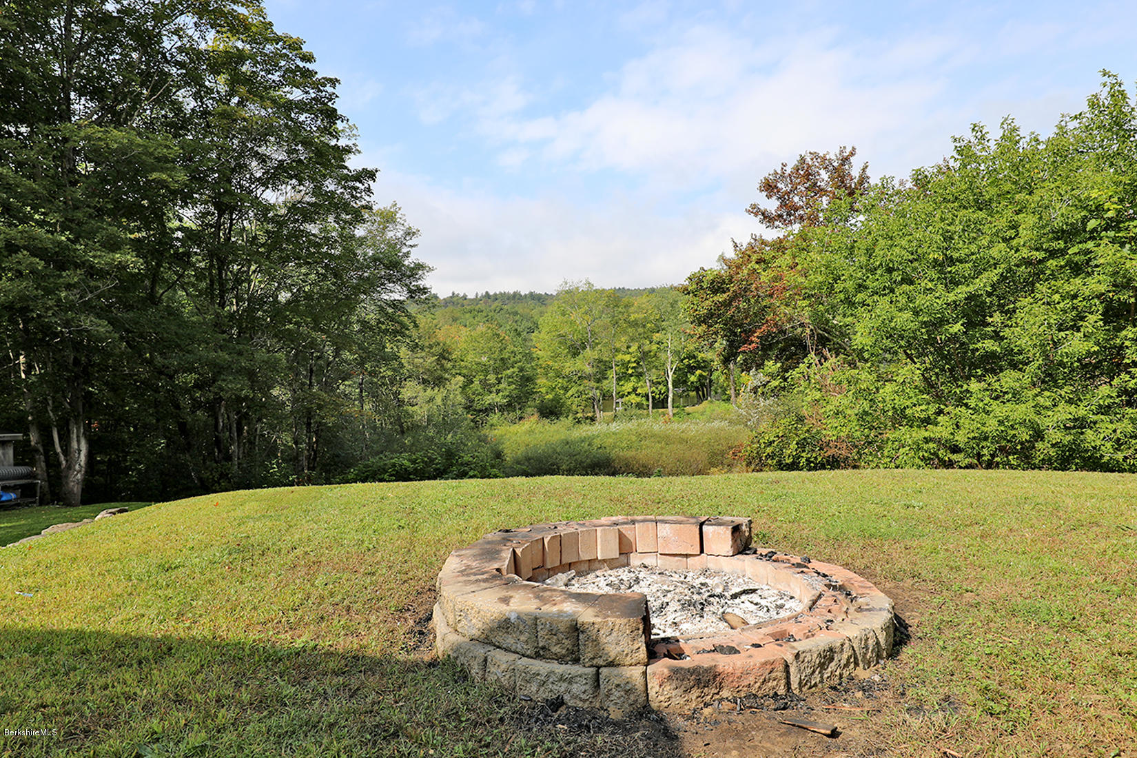 14 Ed Jones Road Otis, MA 01253 - Photo 24 of 28 a view of a yard with an outdoor seating