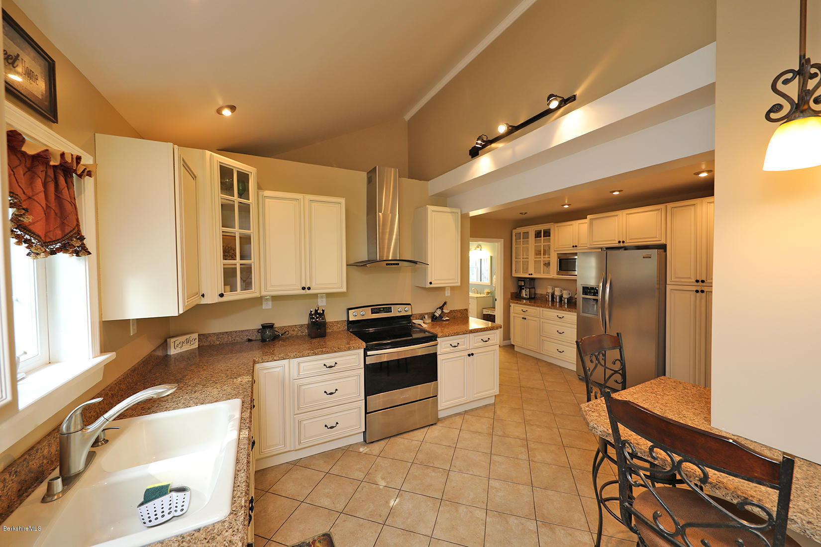 14 Ed Jones Road Otis, MA 01253 - Photo 9 of 28 a kitchen with stainless steel appliances granite countertop a stove a sink and a refrigerator
