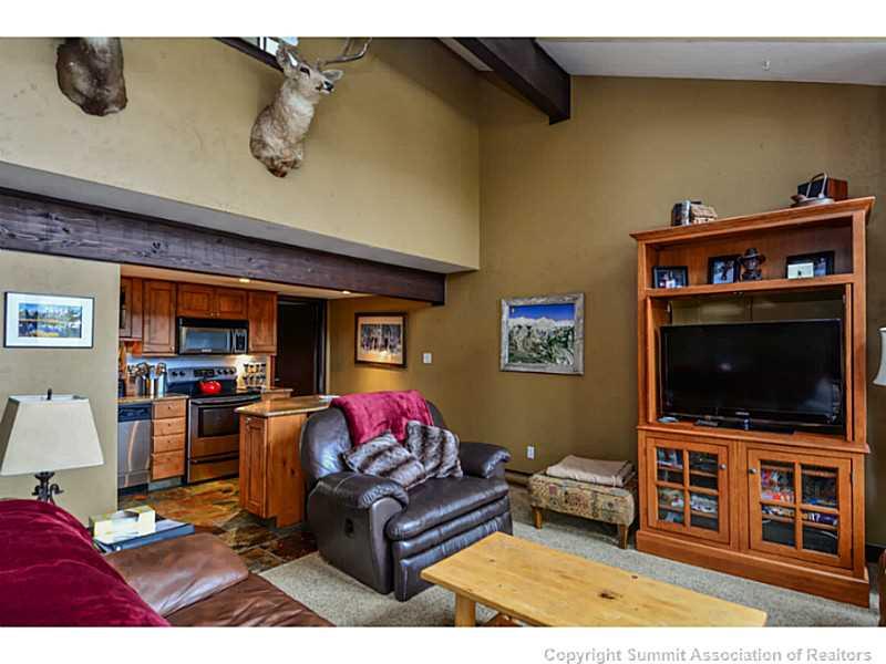 820 Columbine Road, Unit 16B Breckenridge, CO 80424 - Photo 2 of 23 a living room with furniture and a flat screen tv