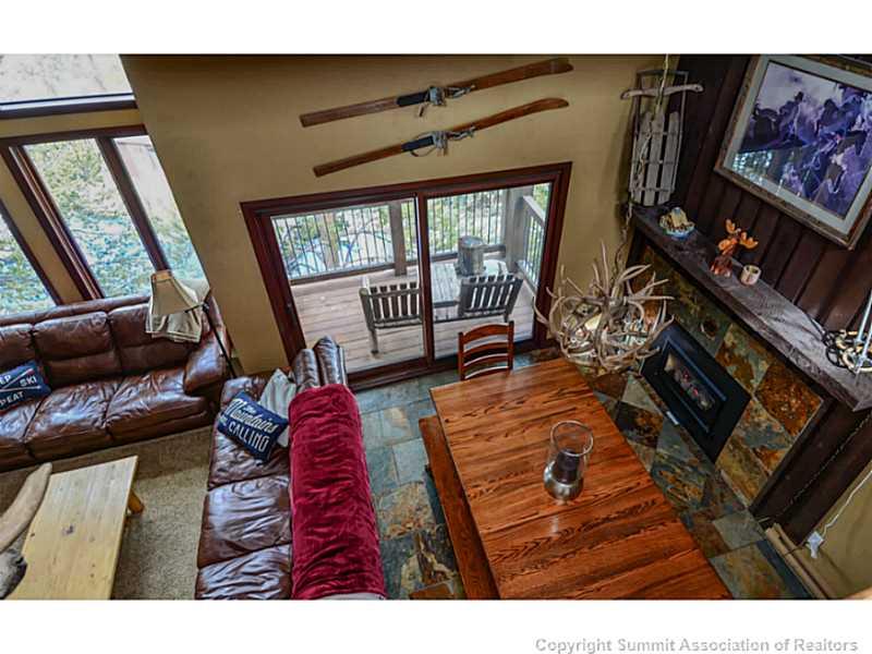 820 Columbine Road, Unit 16B Breckenridge, CO 80424 - Photo 12 of 23 a living room with furniture rug and a large window